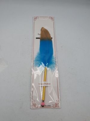 a blue feather pen with a gold tip in a package
