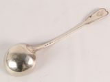 silver plated spoon with a spoon handle on a white surface