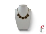 an image of a necklace on a mannequin with a chain