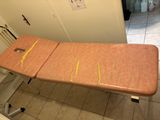 an ironing board sitting on top of a table in a kitchen