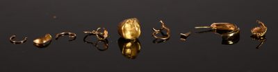 a lot of gold spoons that are in the water