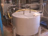 an image of a large metal tank in a factory