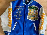 a blue and white jacket with a picture of a person on it