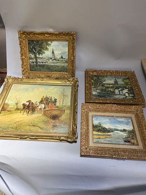 four paintings on a table with a white table cloth