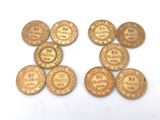 six different types of gold coins on a white surface