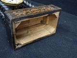 a small wooden box with a clock inside of it