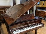 a piano that is sitting in the middle of a room
