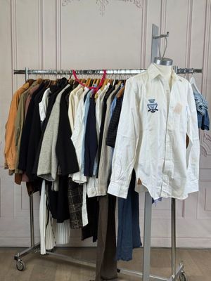 a rack of clothes that is hanging on a clothes rack