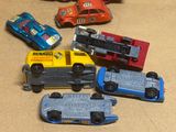 many toy cars that are sitting on a table