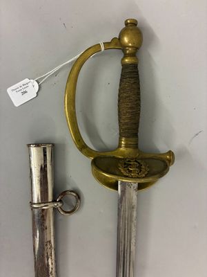 a sword that is sitting next to a lighter