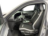 the interior of a car with the door open showing the driver ' s seat area