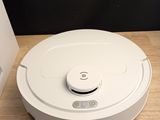 a white robot that is sitting on a table