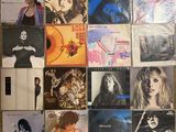 a lot of albums on the wall of the room