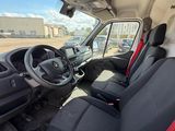 the interior of a truck with red and black seats and a steering wheel