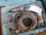 a tool in a case with a cord in it