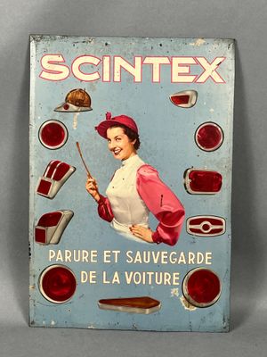 une enseigne en tôle représentant une femme tenant un couteau