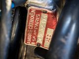 a close up of a red and white license plate on a motorcycle