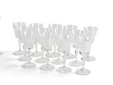 a lot of wine glasses that are sitting on the table