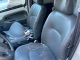the interior of a van with the front seats up and the driver ' s seat down