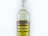 a bottle of alcohol sitting on top of a white surface