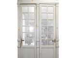 a white double door with a window above it