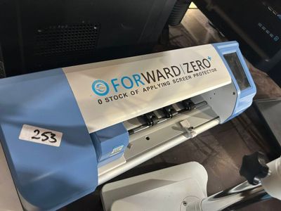 a picture of a blue and white machine with a sign on it