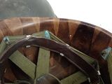 a close up of a helmet with a leather strap