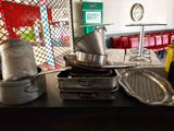 many pots and pans that are on a table