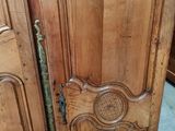 a wooden door that has a carved design on it