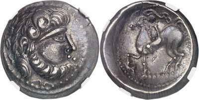 a close up of a silver coin with a woman on it