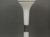 an image of a white table lamp on a gray surface