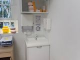 a small bathroom with a sink and a cabinet