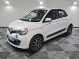a picture of a white smart car parked in a garage