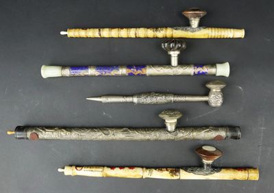 several different types of wooden and metal items on a black surface