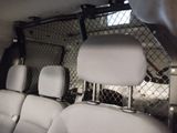 the back seats of a van with a dog in the back