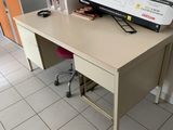 a desk with a printer on top of it in a room