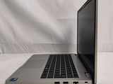 an open laptop computer sitting on top of a white table