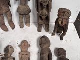 a lot of wooden figurines that are sitting on a table