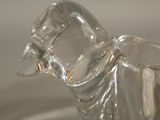 a clear glass vase with a bird on it