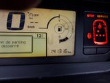 a close up of a car ' s dashboard with a stop sign