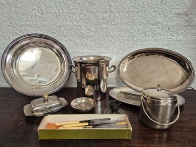 a table with silverware on it and a knife on the table
