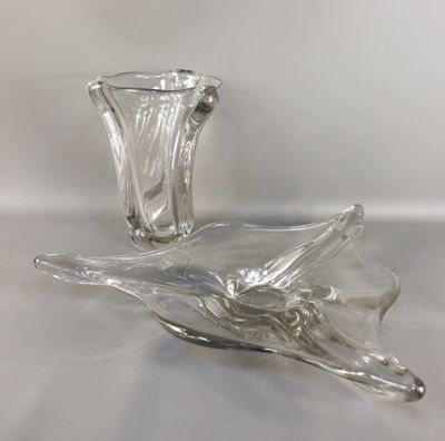 two glass vases sitting on a table with a white background