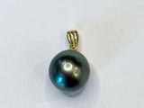 an image of a black pearl pendant on a white surface