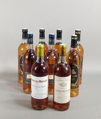 several bottles of wine are lined up on a table