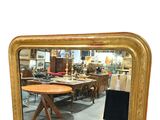 a mirror that is sitting on the floor in a room