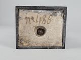 a black and white picture of a box with the word t e b on it