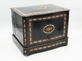 a small black box with a decorative design on it