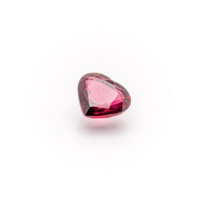 a heart shaped pink tourmaline gems on a white background