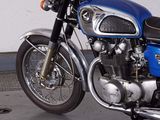a blue motorcycle that is parked in a garage