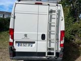 a white van that is parked on the side of the road